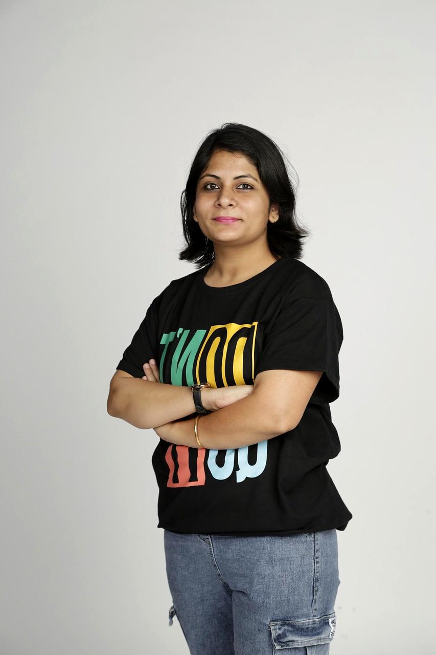 Person working on a laptop surrounded by browser tabs and notes